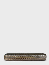 Vegan leather woven-embossed evening clutch in pewter with sculptural gold handle shown from a base view
