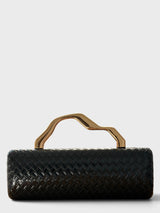 Vegan leather woven-embossed clutch in black with sculptural gold top handle. 